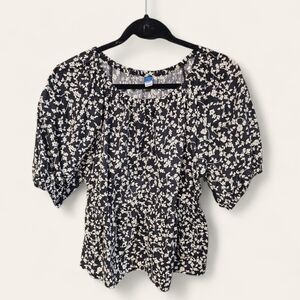 Ladies Blouse, peplum with puff sleeve and back cutout.